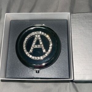 Brand new compact mirror Letter A initial